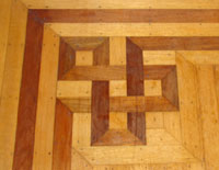 inlaid walnut floors in the music and breakfast parlors
